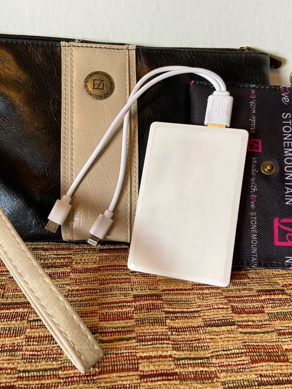 Stone Mountain clutch with White Power Bank enclosed in matching liner